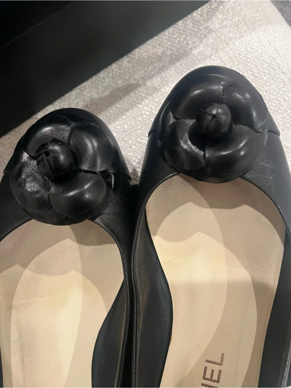 CHANEL Black Leather Camellia Round-Toe Flats